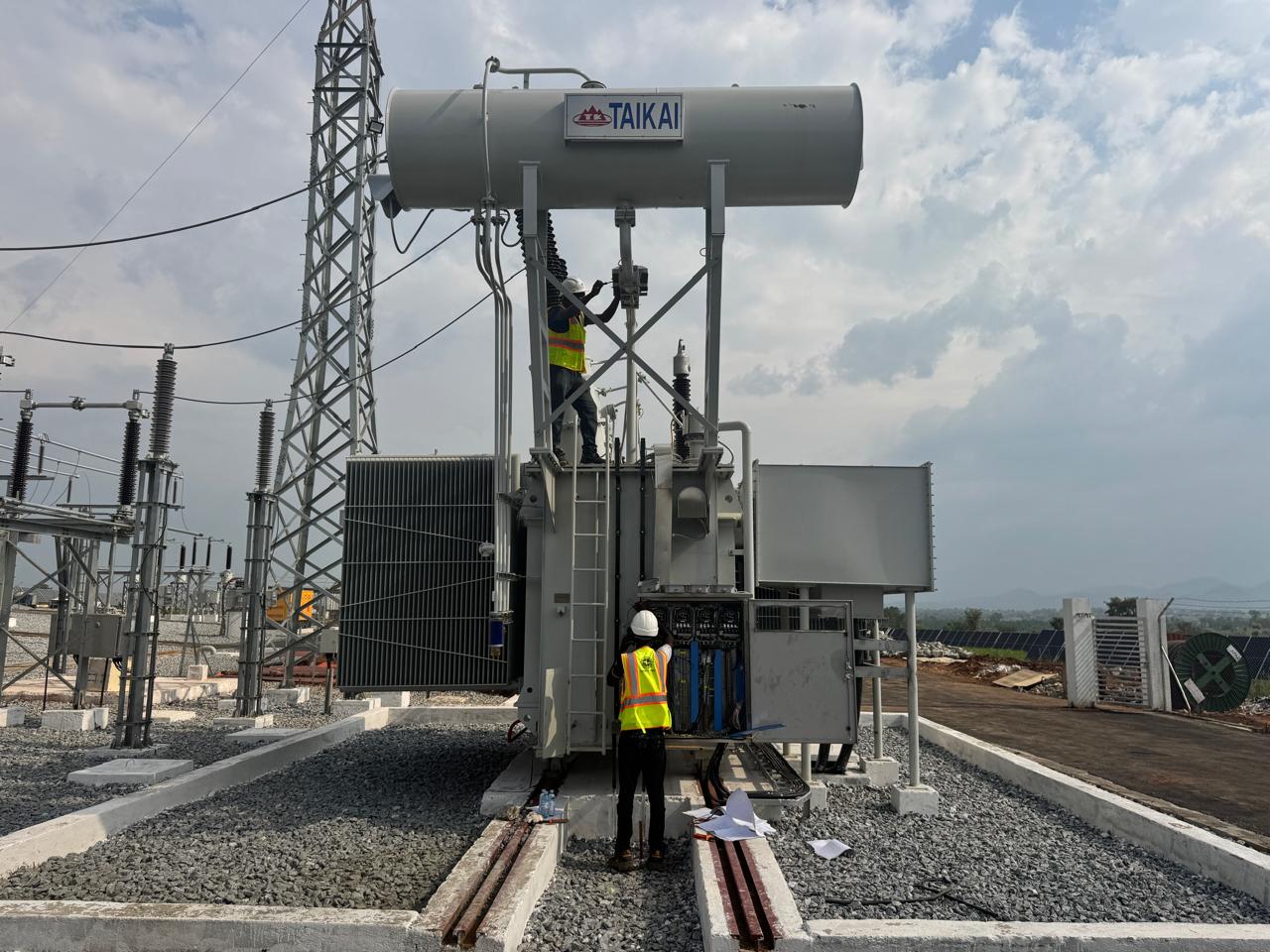 Engineers wiring the main power transformer at the 25MWp PV plant